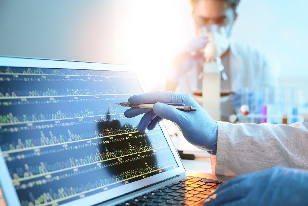 orig scientist looking at a DNA sequence  Getty-483674559_1714026644309 (1).jpg